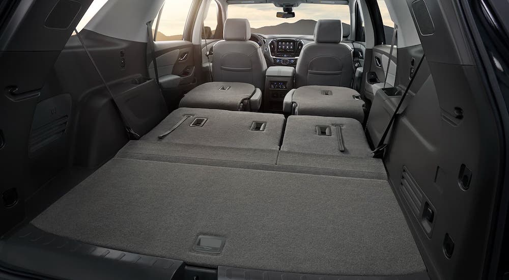 The seats are down showing the cargo area in a 2020 Chevy Traverse.