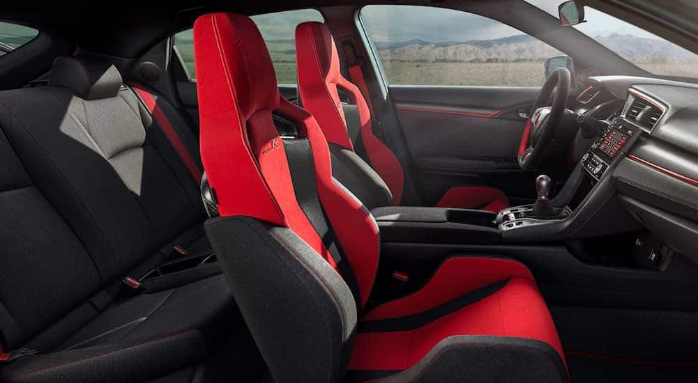 The black and red interior of a 2020 Honda Civic Type R is shown.