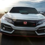 A white 2020 Honda Civic Type R is shown from the front on a race track.