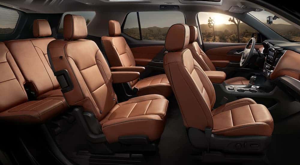 The brown interior of a 2020 Chevy Traverse is shown from the side.