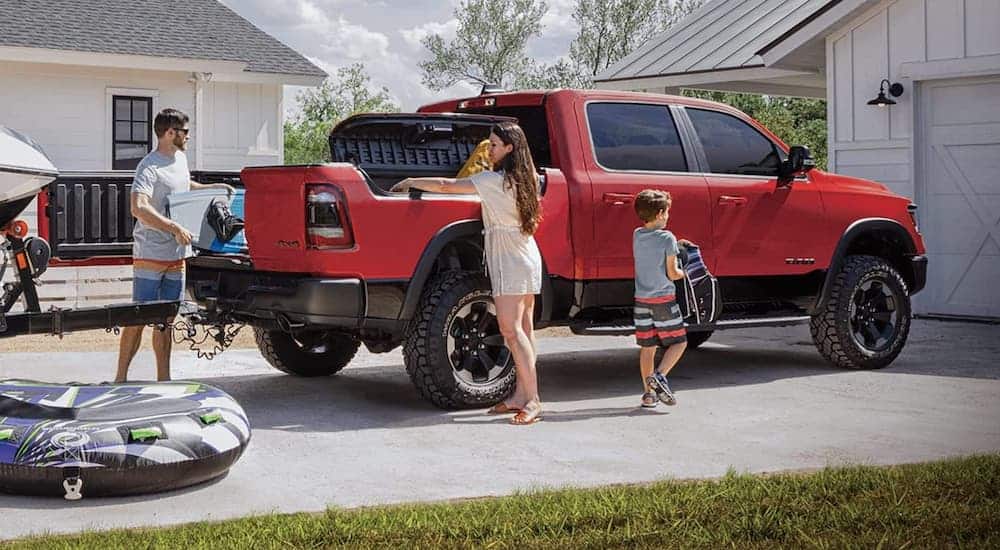 A family is loading up the Ram Box system with beach supplies at their house.