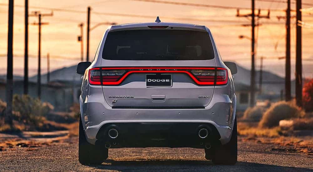 A silver 2020 Dodge Durango SRT is shown from the rear at sunset.