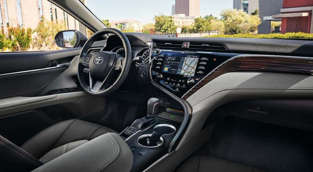 The luxurious and high tech interior of a 2020 Toyota Camry is shown.