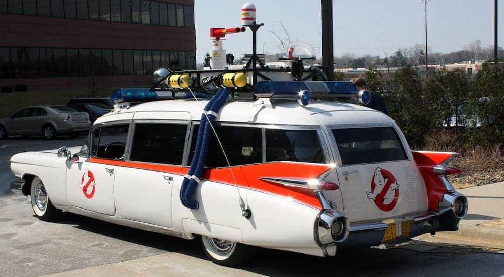 The classic car, the Ecto1 from Ghostbusters, is shown.