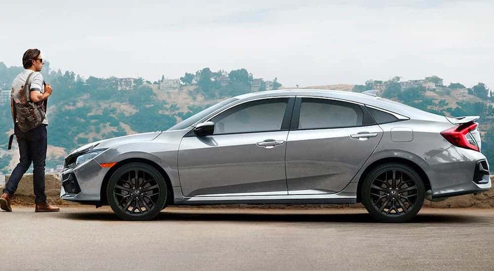 A silver 2020 Honda Civic SI is shown from the side after leaving a local Honda Dealer.