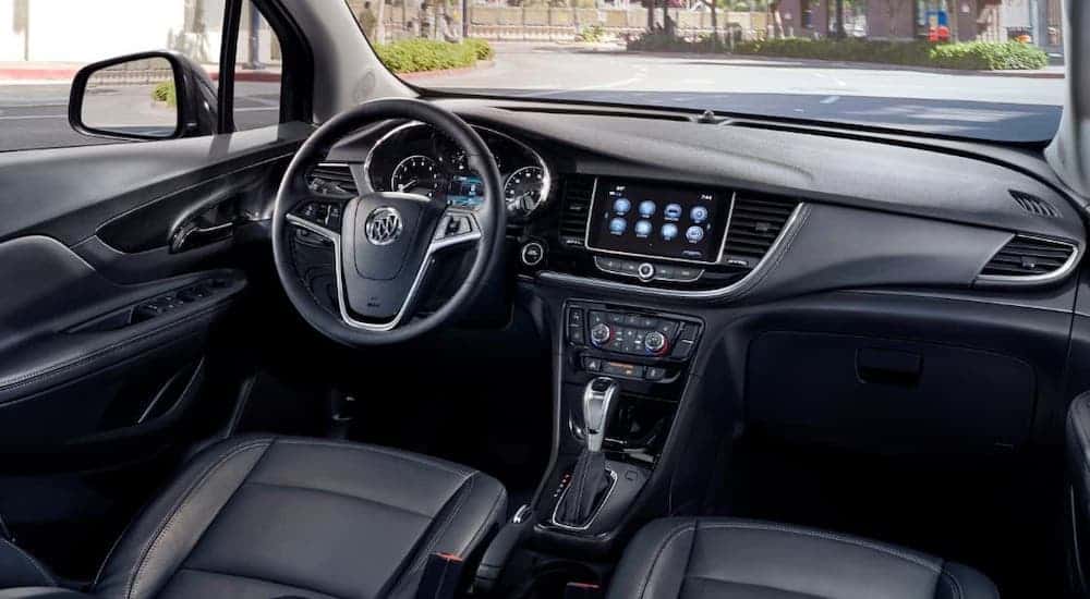 The black interior of a 2020 Buick Encore is shown, the winner of the 2020 Buick Encore vs 2020 Mazda CX-30 comparison.