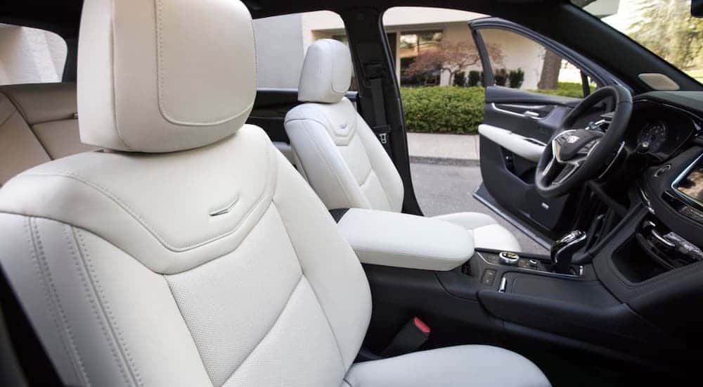 The white front seats of a 2020 Cadillac XT5 are shown from the passenger side.