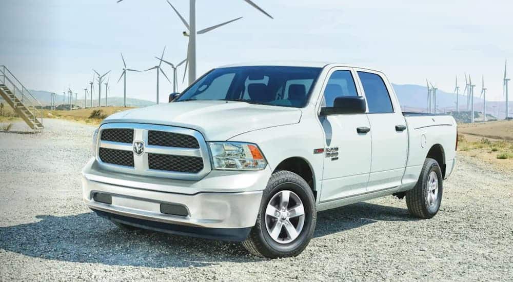 A white 2020 Ram 1500 Classic is parked in front of windmills.