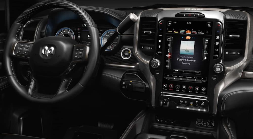 The dashboard and touch screen are shown in a 2020 Ram 2500.