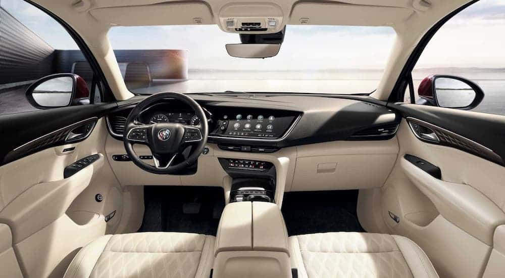 The white and black interior if a 2021 Buick Envision is shown.