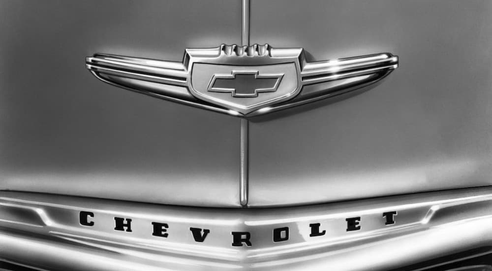 A black and white photo of 1947 Chevrolet Fleetmaster is showing a close up of the chevy emblem.