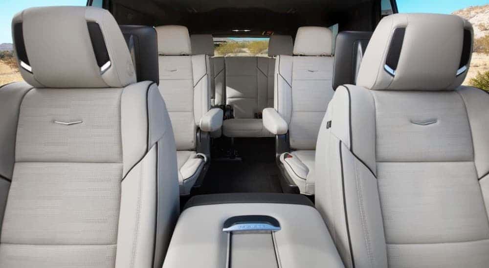 A view of the interior of a 2021 Cadillac Escalade from the perspective of the windshield is shown.