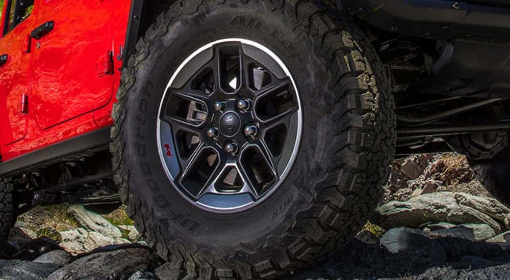 The wheel of a 2020 Jeep Wrangler Unlimited Rubicon is shown in closeup.