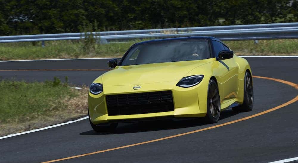 A yellow 2021 Nissan 400Z is driving on a race track.