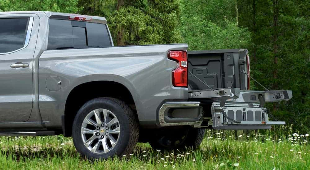 The Multi-Flex tailgate is open with the step on a grey 2021 Chevy Silverado 1500.