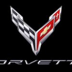 The Chevy Corvette dual racing flag emblem is shown on a black background.