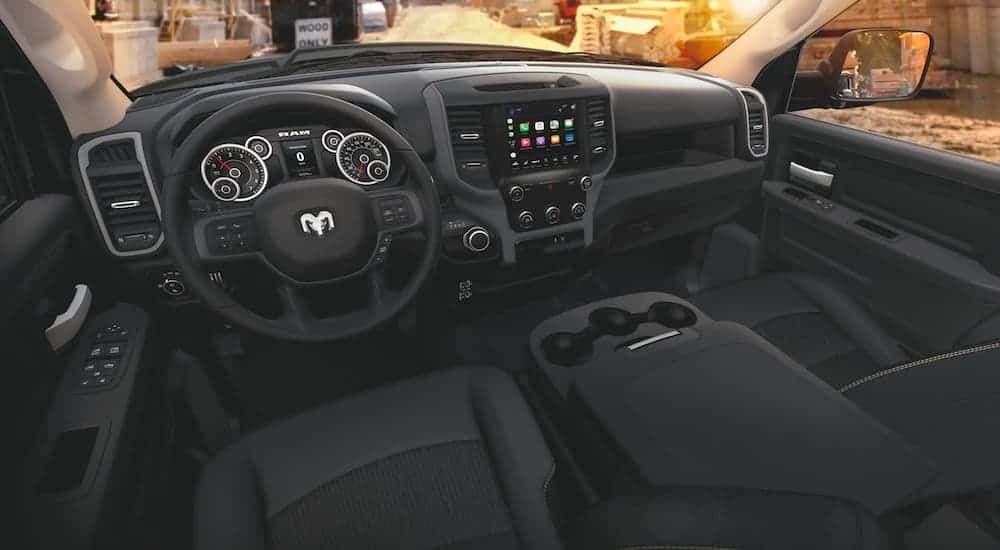 The black interior is shown on a 2020 Ram 3500 Tradesman from the back seat.