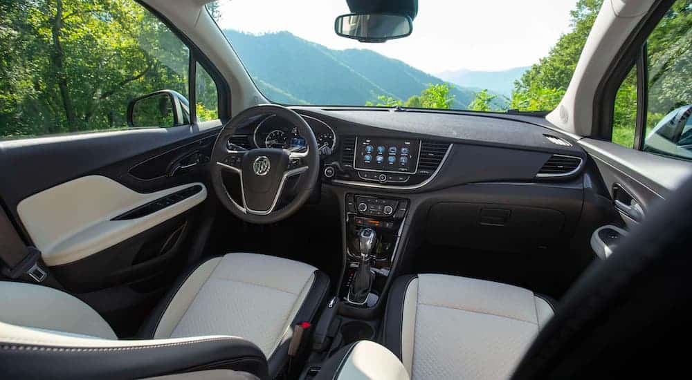 The black and white interior is shown on a 2021 Buick Encore.