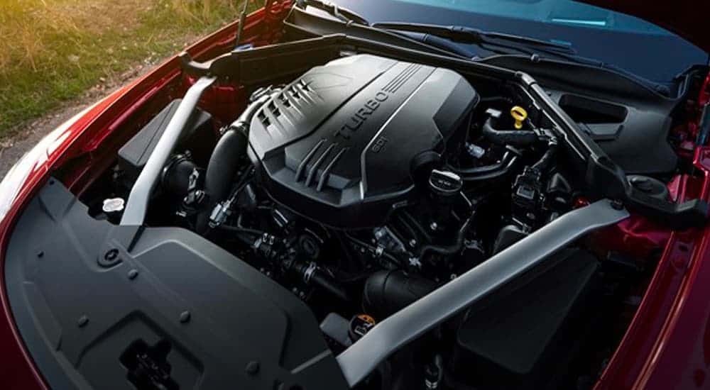 The engine is shown in close up on a red 2021 Kia Stinger.