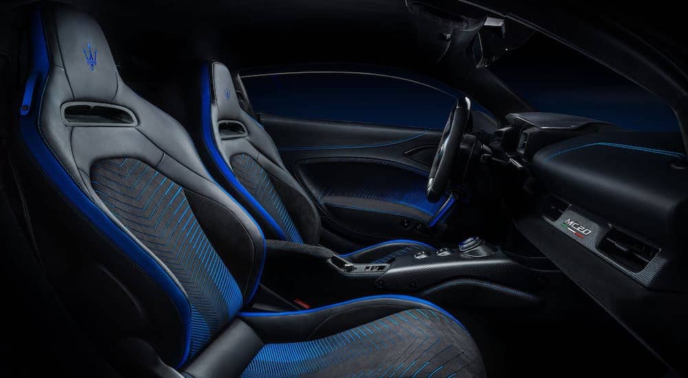 The black and blue interior is shown on a 2021 Maserati MC20.