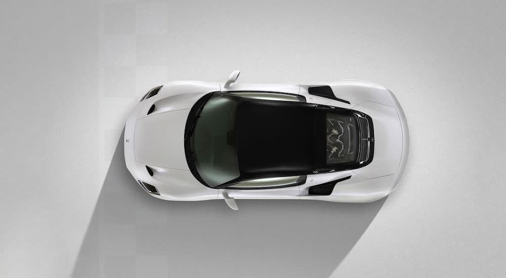 A white 2021 Maserati MC20 is shown from an aerial view against a white background.