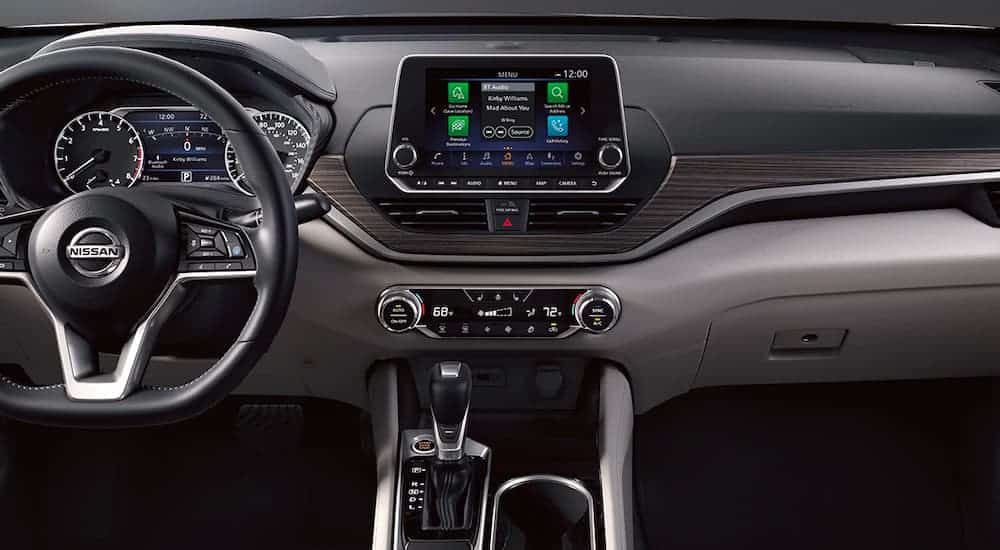 The black interior and infotainment system is shown in a 2021 Nissan Altima.