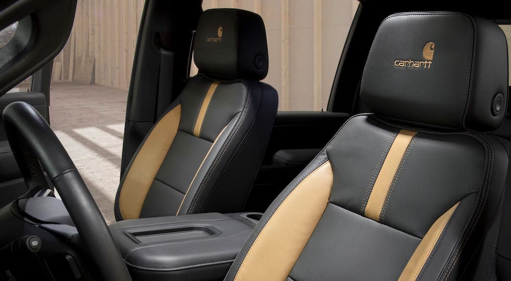 The black and tan leather seats are shown in a 2021 Chevy Silverado 2500HD Carhartt edition.