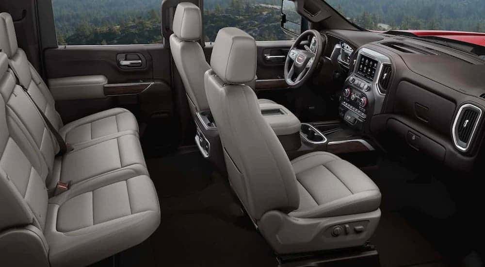 The light gray rows of seats are shown in a 2021 GMC heavy duty truck.