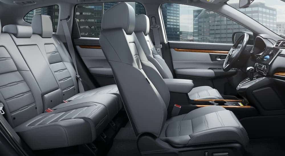 The black and grey interior is shown on a 2021 Honda CR-V Hybrid.