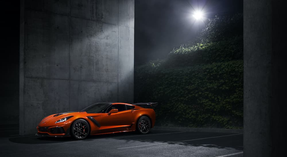 An orange 2019 Chevy Corvette ZR1 is shown in a parking garage after visiting a Certified Pre-Owned Chevy dealer.