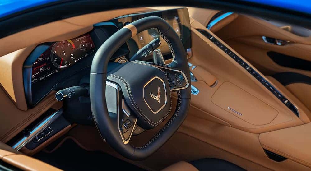 The tan and black interior is shown on a 2021 Chevy Corvette.