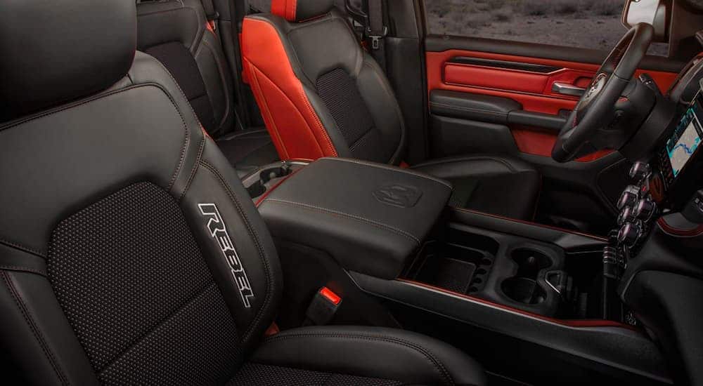 The red and black interior is shown on a 2021 Ram 1500 Rebel .
