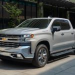 A tan 2021 Chevy Silverado LTZ is driving through the city after leaving a New Jersey Chevy truck dealer.