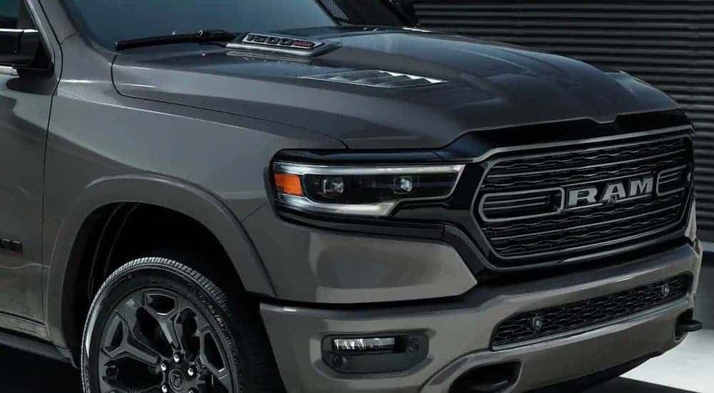 A closeup shows the hood on a gray 2021 Ram 1500 at a Southern California Diesel truck dealer.