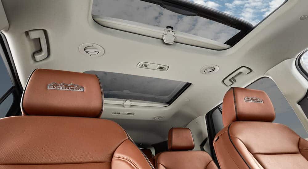 The brown and tan interior is shown from a low angle on a 2021 Chevy Traverse High Country.