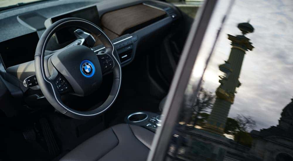 The black interior is shown from the drivers side on a 2019 BMW i8.