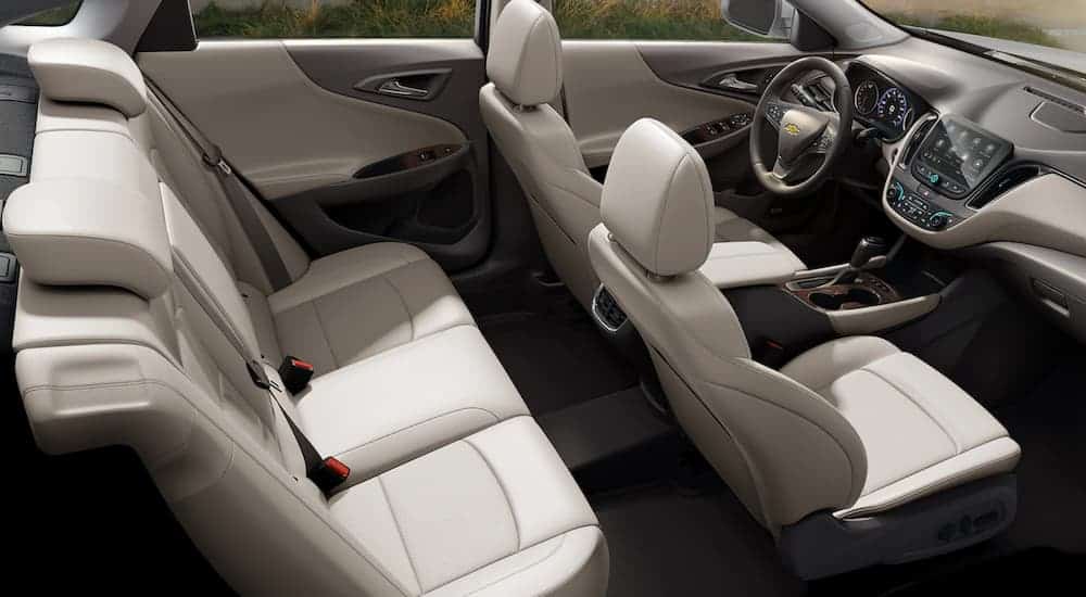 The white interior of a 2021 Chevy Malibu is shown.