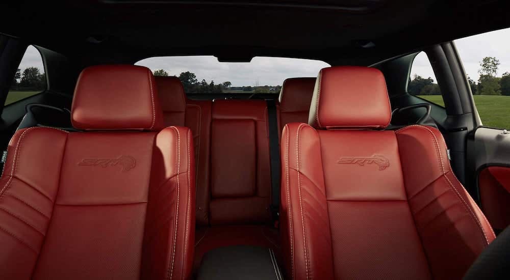 The red front seats and interior is shown on 2021 Dodge Challenger.
