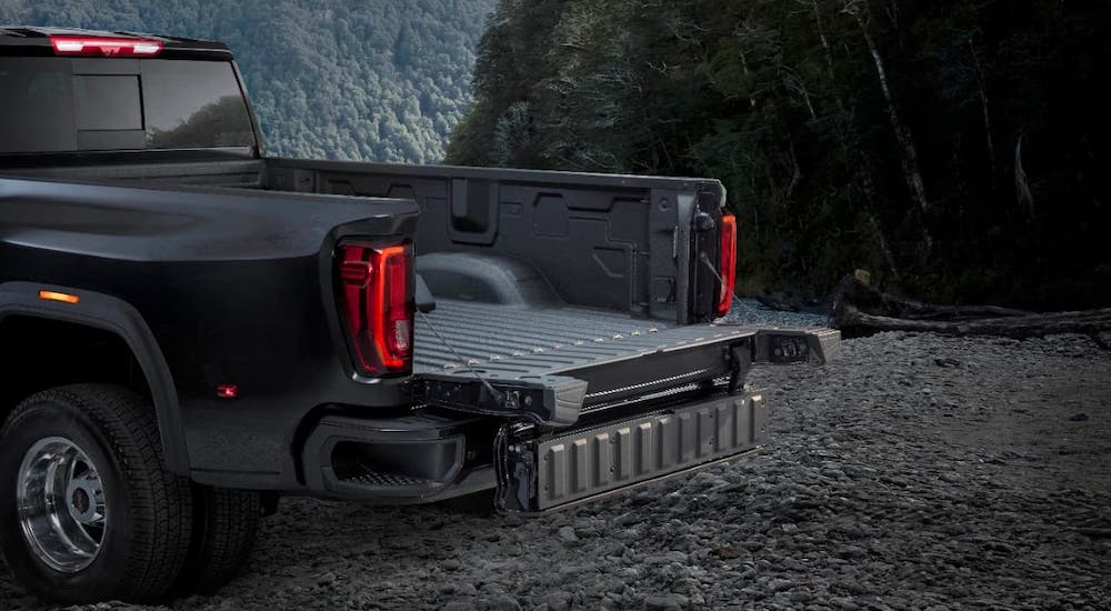 A closeup shows the MultiPro tailgate on a black 2021 GMC Sierra 3500HD.