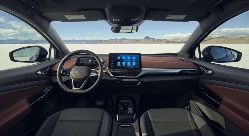 The interior dashboard and seats are shown in a 2021 Volkswagen ID.4.