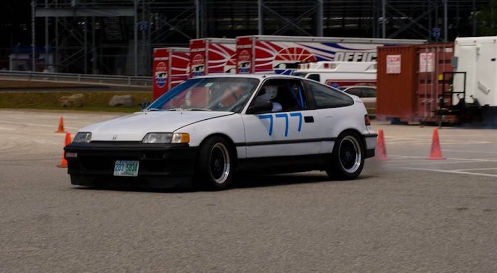 A white 1991 Honda CRX is shown during an autocross event.