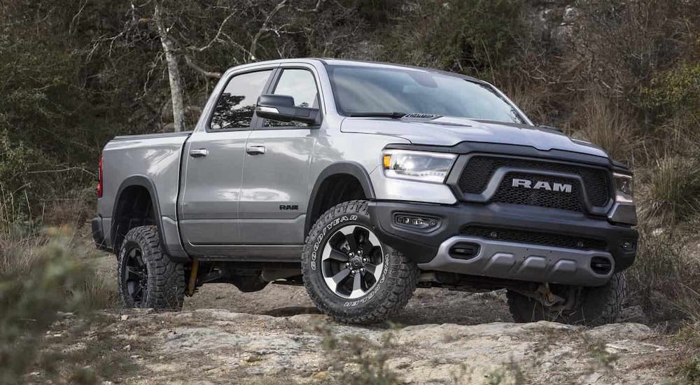 A gray 2021 Ram 1500 Rebel is on a dirt trail.