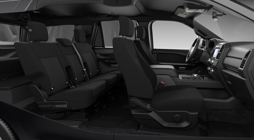 The black interior is shown from the passenger side in a 2021 Ford Expedition XL SXT.