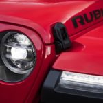 A closeup shows the headlight and Rubicon badging on a 2020 used Jeep Wrangler Rubicon.