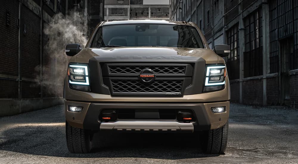 A 2021 Nissan Titan Tan is shown from the front.