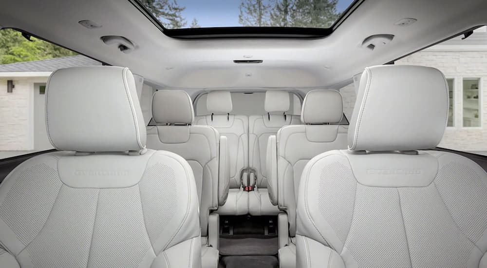 the white interior of a 2021 Jeep Grand Cherokee L shows all three rows of seating.