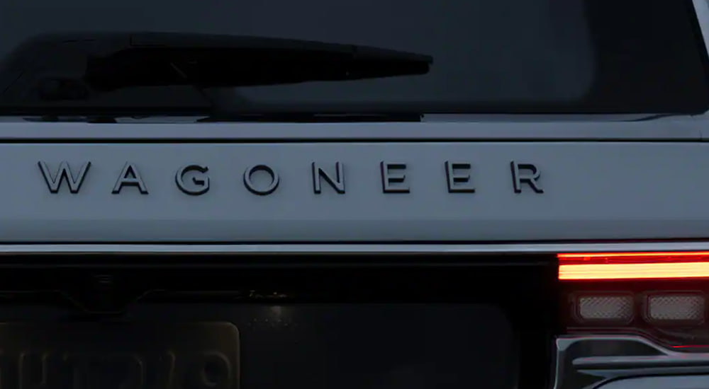 The 2022 Wagoneer emblem is shown at dusk.