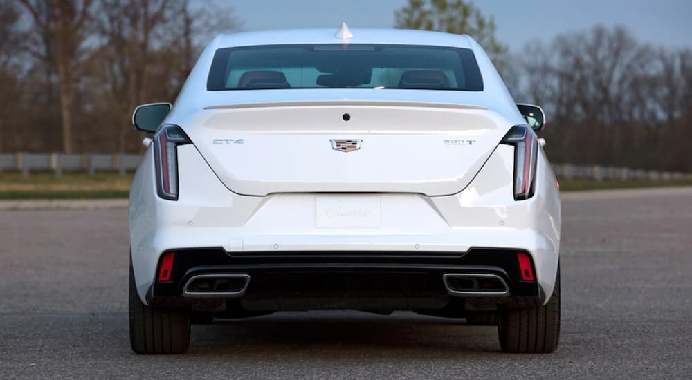 The rear of a white 2021 Cadillac CT4 is shown parked in a lot.