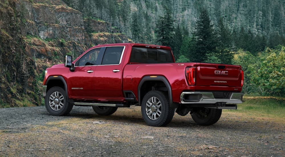 A red used 2020 GMC Sierra 2500 is parked in the forest.