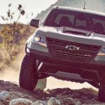 A used grey 2020 Chevy Colorado ZR2 is off roading after leaving a used truck dealership.